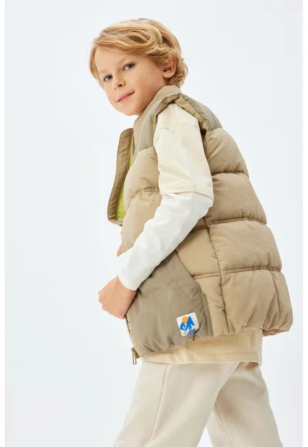 Капитониран елек