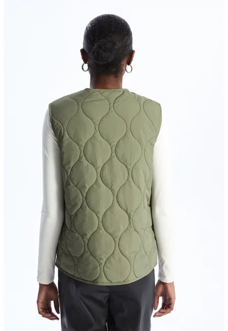 Капитониран елек с капси