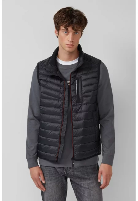 Капитониран елек с джобове с цип